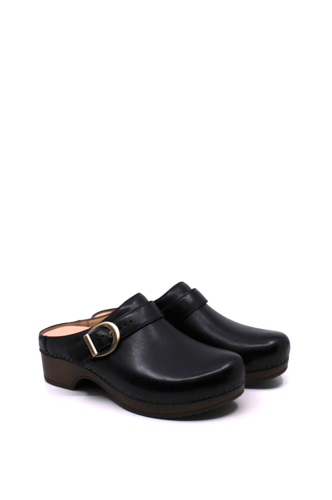 backless clog features a bold buckle and beautiful black leather from dansko