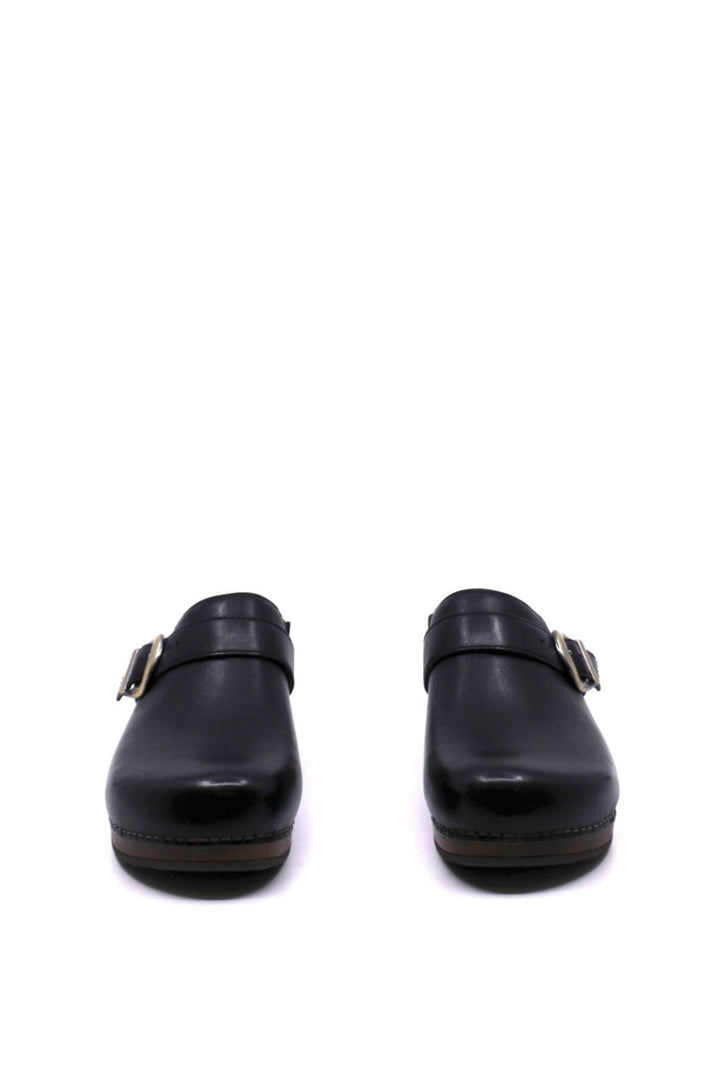 backless clog features a bold buckle and beautiful black leather from dansko