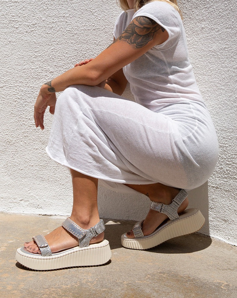 DEBRA is the elevated, on-the-go sandal you need in your life. With a cool, modern platform sole and velcro straps, these shoes are perfect for those on-the-move moments. Comfy and current, they're the go-anywhere, do-anything look you've been searching for