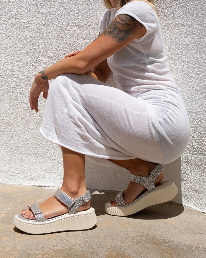 DEBRA is the elevated, on-the-go sandal you need in your life. With a cool, modern platform sole and velcro straps, these shoes are perfect for those on-the-move moments. Comfy and current, they're the go-anywhere, do-anything look you've been searching for