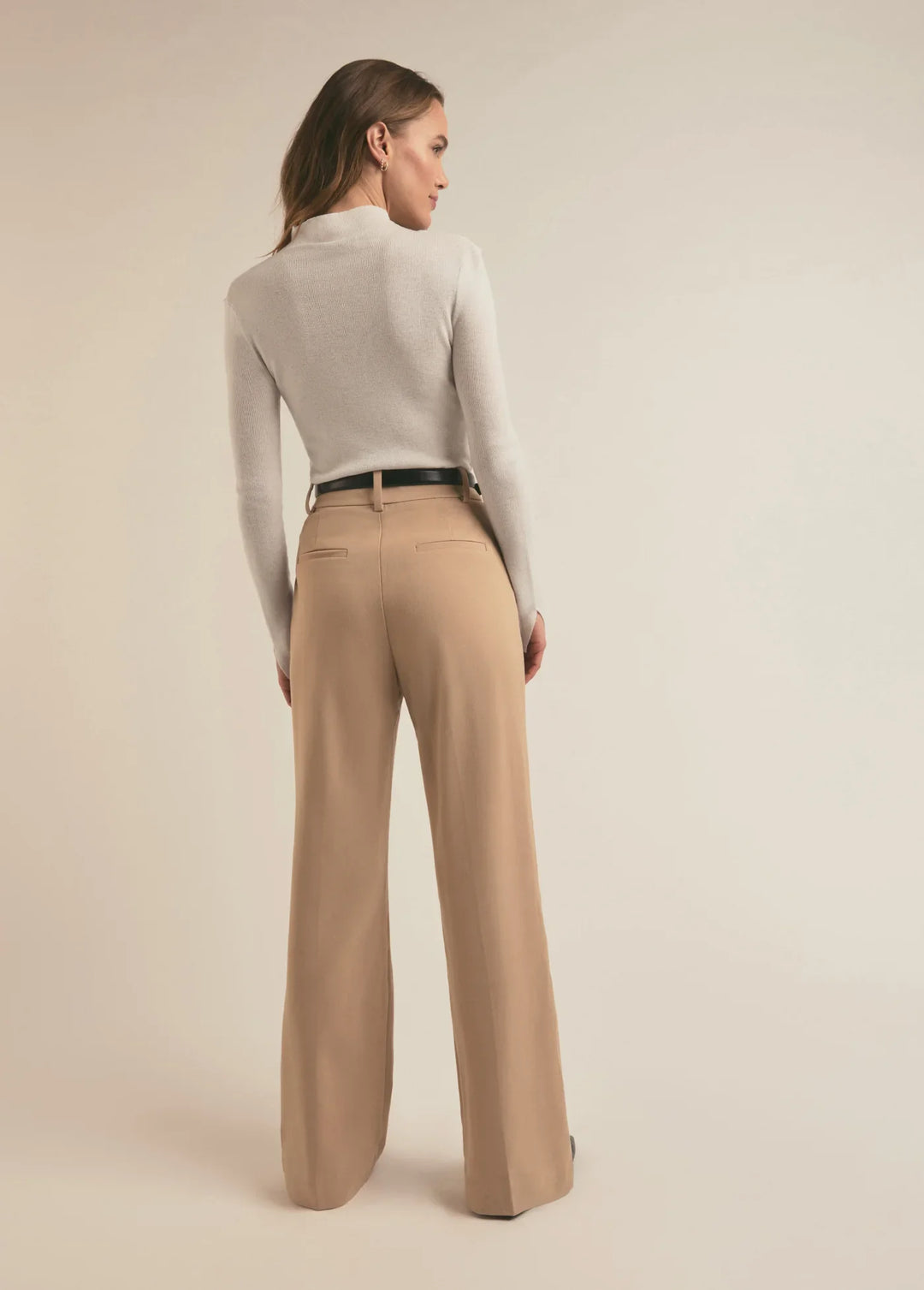 Favorite Daughter Jackie Sweater back view - Dear Lucy
White ,half button up, tight fitting long sleeve shirt in a sweater material with a mock neck.