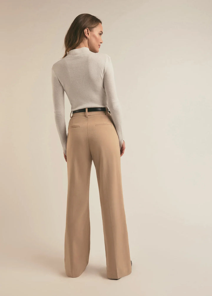 Favorite Daughter Jackie Sweater back view - Dear Lucy
White ,half button up, tight fitting long sleeve shirt in a sweater material with a mock neck.