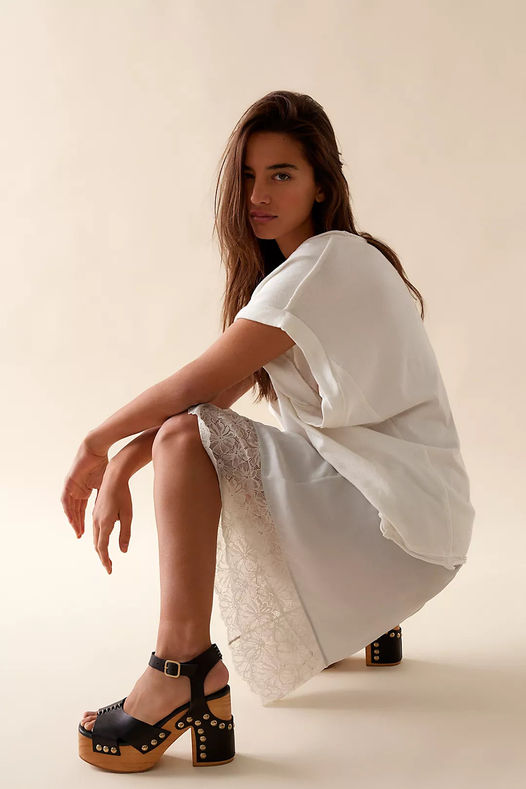 Free People Cecily Studded Clog Black - Dear Lucy
Platform, heeled clog with a wooden base and black leather upper toe strap and ankle strap with studding throughout. 