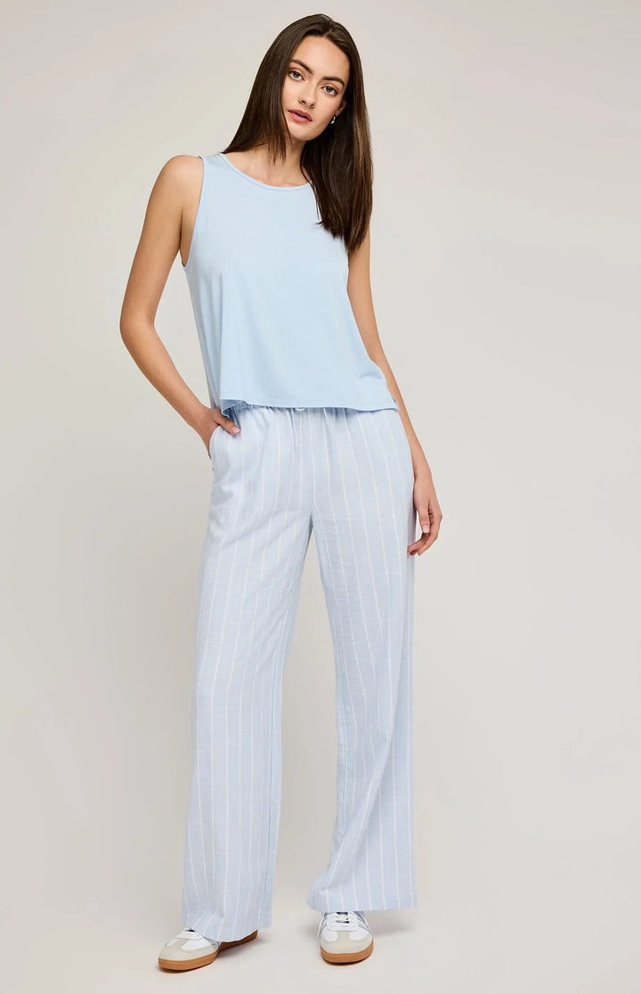 Linen pants feature slash pockets and an elasticated waistband in blue with white stripes by gentle fawn 