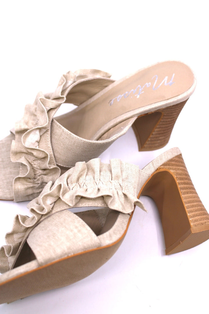Matisse Pleasant Natural Linen top view- Dear Lucy Heel featuring a wooden heel and linen upper with a criss-cross strap and ruffles.