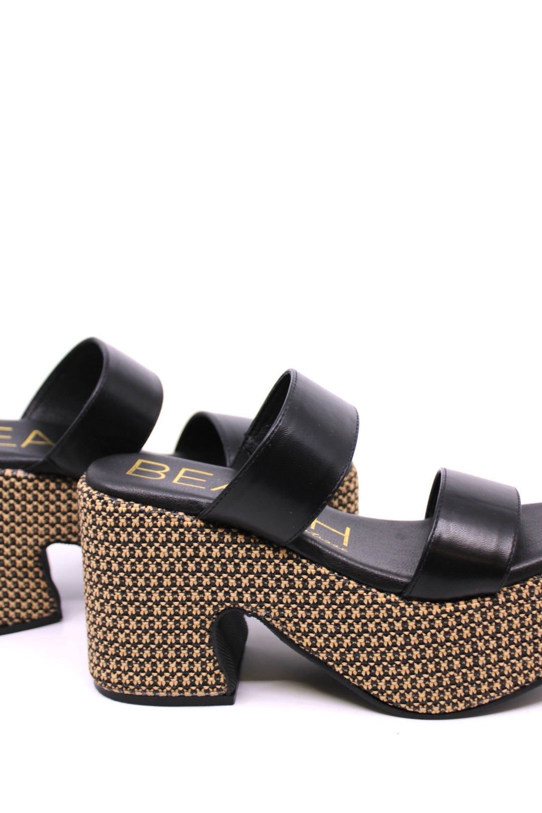 Matisse West Haven Black side view - Dear Lucy Platformed heel sandal with a mixed black and natural raffia on the base and a black leather upper with 2 foot straps.