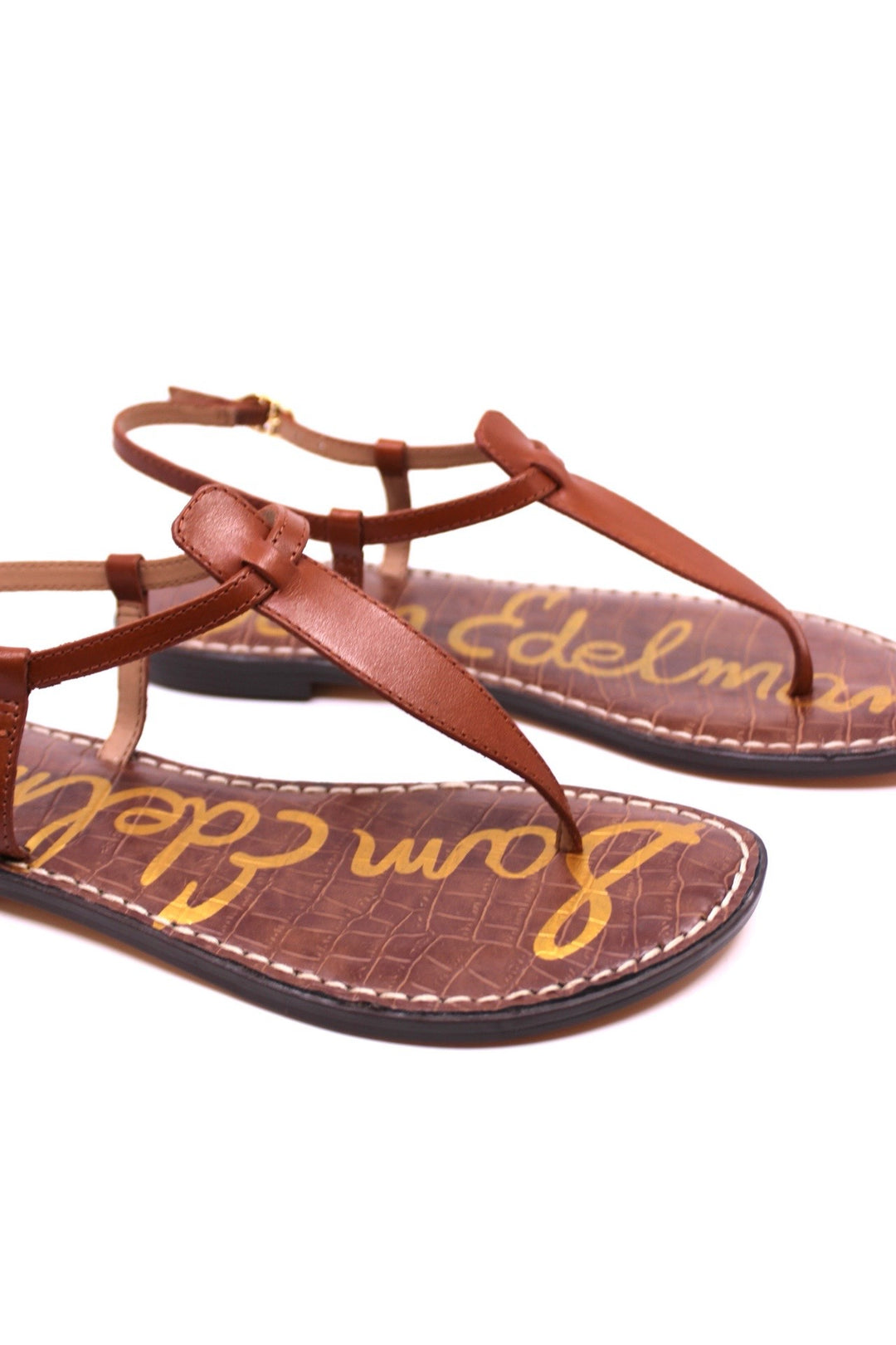 Sam Edelman GiGi Kona Brown side view - Dear Lucy Featuring slim leather straps, a classic thong silhouette, and a lightly cushioned footbed,