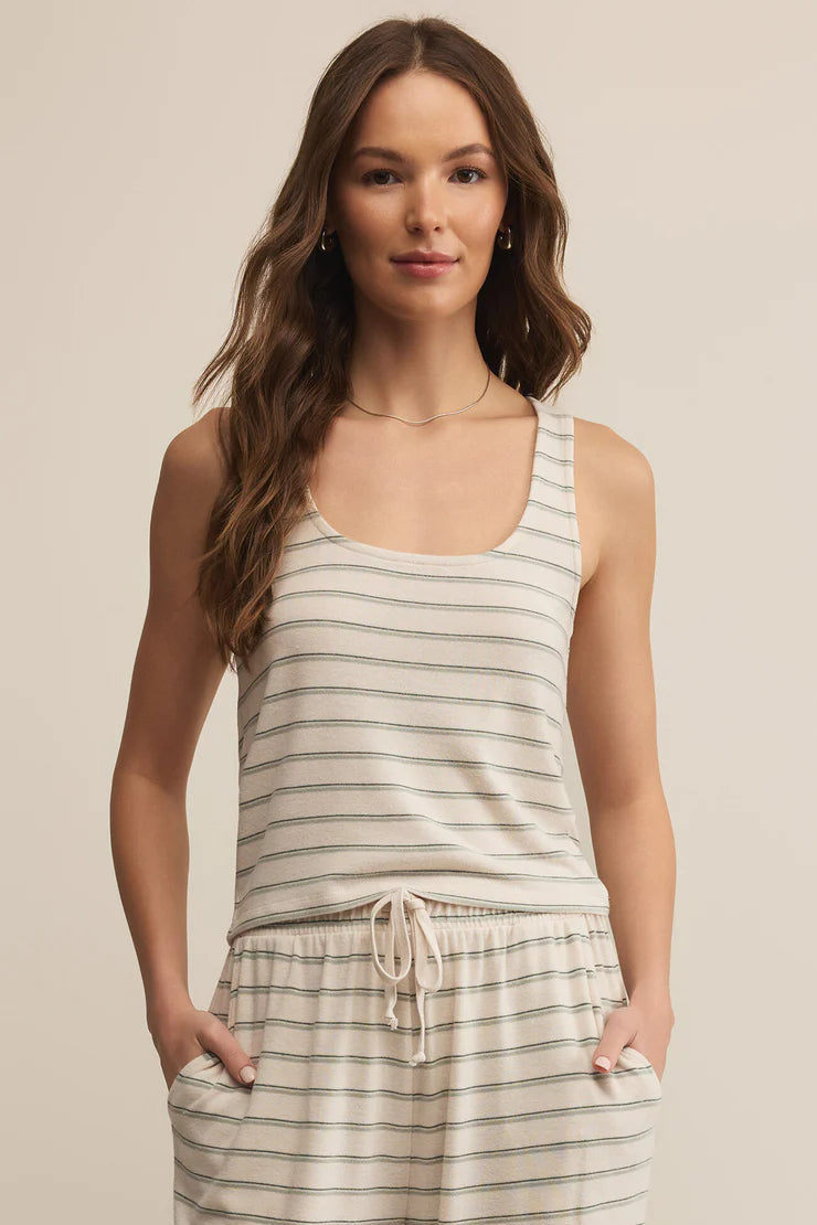 The Lana Stripe Tank by Z Supply is the ultimate layering tank for fall lounging and slow Sunday mornings. Made from a soft, brushed knit with subtle horizontal stripes, it features a relaxed scoop neckline, a slightly cropped hem, and a breathable feel that transitions perfectly into cooler weather.