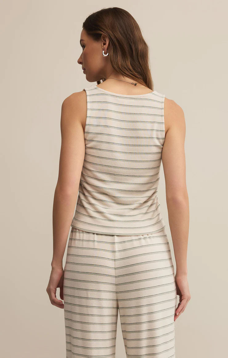 The Lana Stripe Tank by Z Supply is the ultimate layering tank for fall lounging and slow Sunday mornings. Made from a soft, brushed knit with subtle horizontal stripes, it features a relaxed scoop neckline, a slightly cropped hem, and a breathable feel that transitions perfectly into cooler weather.