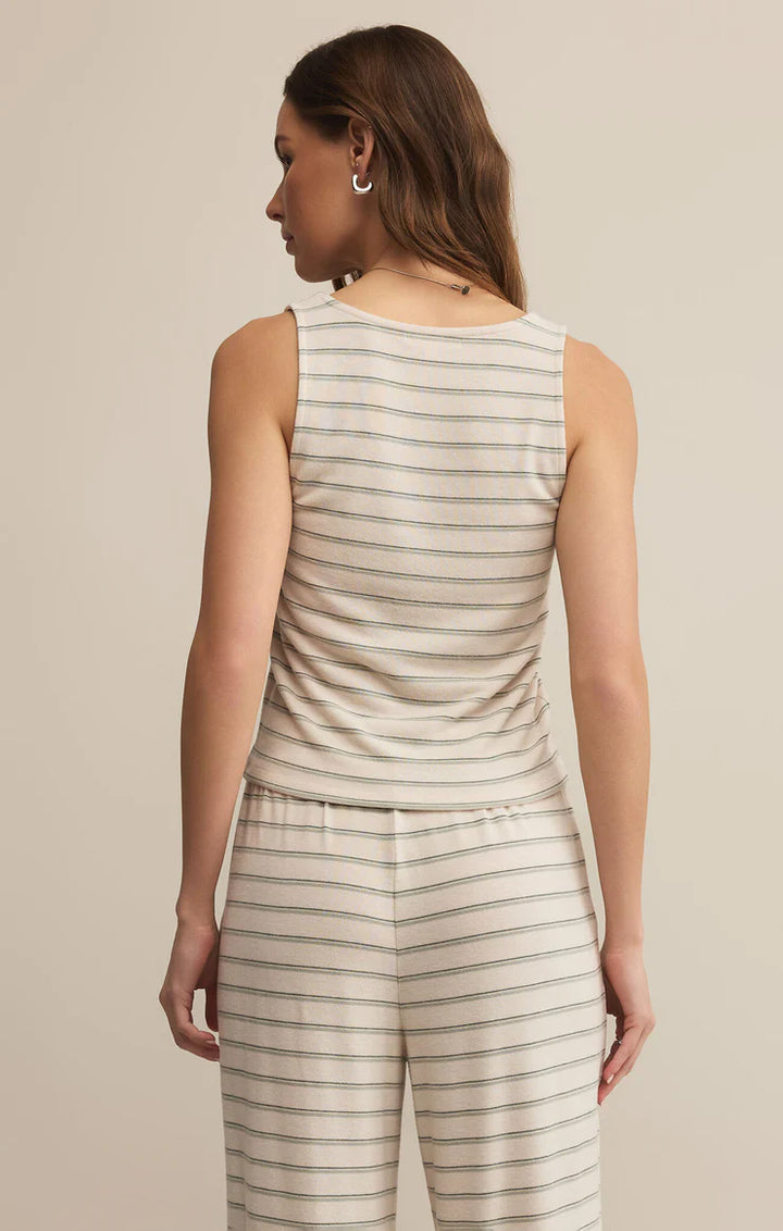 The Lana Stripe Tank by Z Supply is the ultimate layering tank for fall lounging and slow Sunday mornings. Made from a soft, brushed knit with subtle horizontal stripes, it features a relaxed scoop neckline, a slightly cropped hem, and a breathable feel that transitions perfectly into cooler weather.