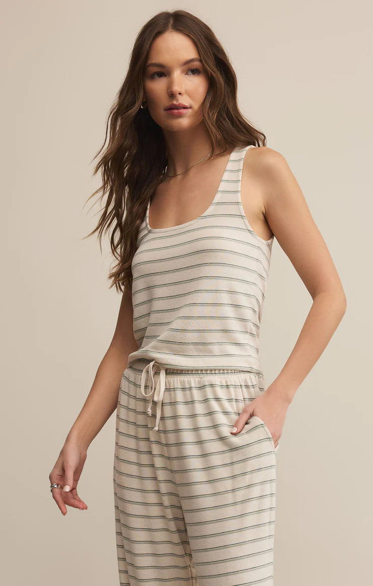 The Lana Stripe Tank by Z Supply is the ultimate layering tank for fall lounging and slow Sunday mornings. Made from a soft, brushed knit with subtle horizontal stripes, it features a relaxed scoop neckline, a slightly cropped hem, and a breathable feel that transitions perfectly into cooler weather.