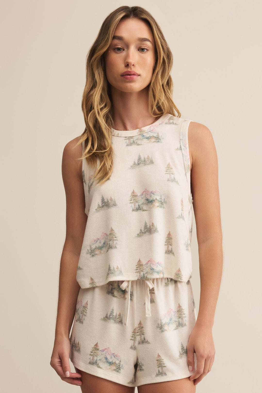 The Warmer Days Road Trip Tank by Z Supply is the perfect piece to ease into fall while holding on to summer’s spirit. This soft brushed tank features an allover scenic print of pastel trees and mountains, bringing a dreamy, outdoorsy feel to your lounge look.